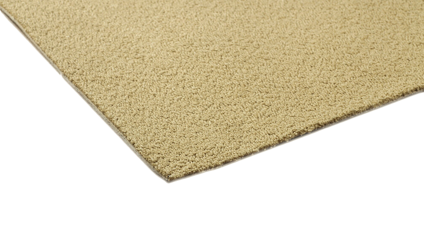 Beige carpet tile in close-up – textured surface and precise cut edge for perfect installation.